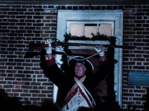 A volunteer dressed up as a Continental Army soldier explains to the crowd about the musket used during the Revolutionary War (Photo/Mazza)